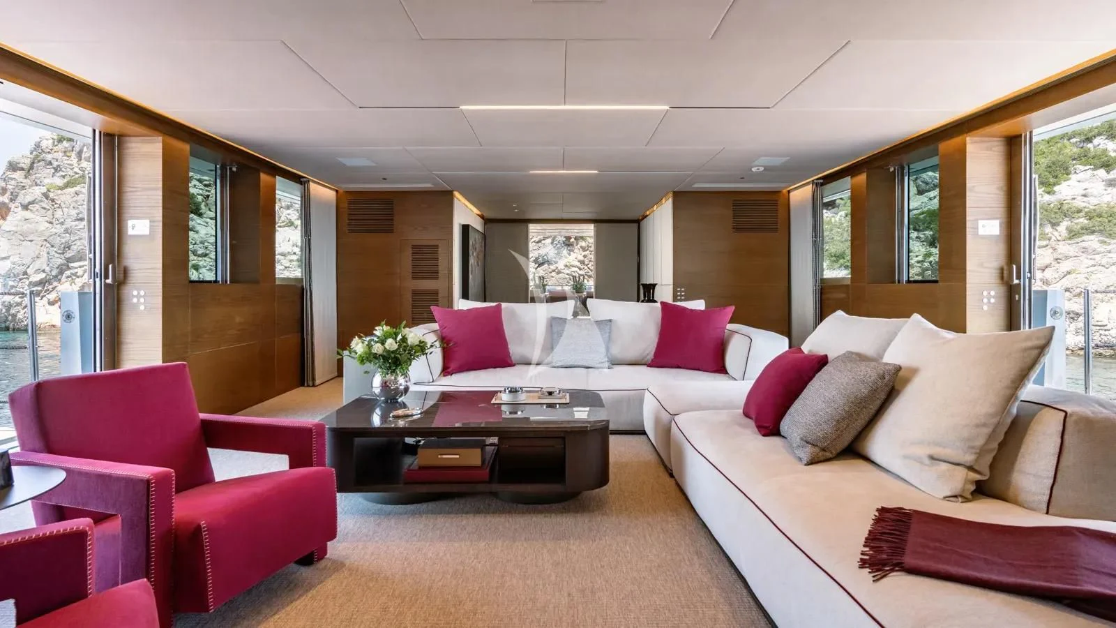 a living room with a couch and a coffee table aboard NAIA Yacht for Sale
