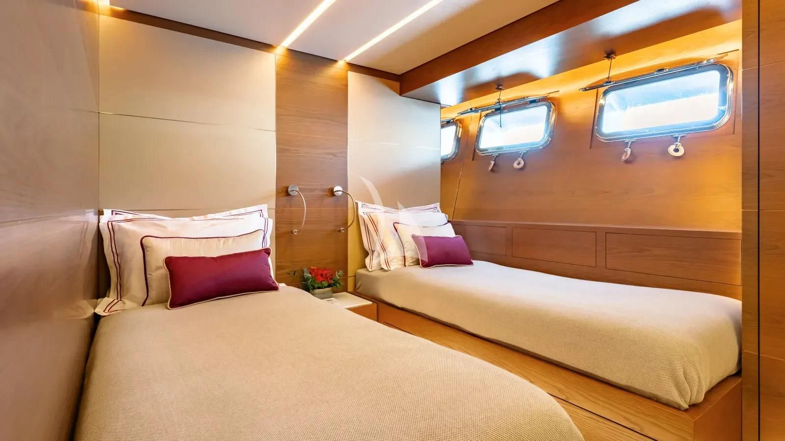 a room with two beds aboard NAIA Yacht for Sale
