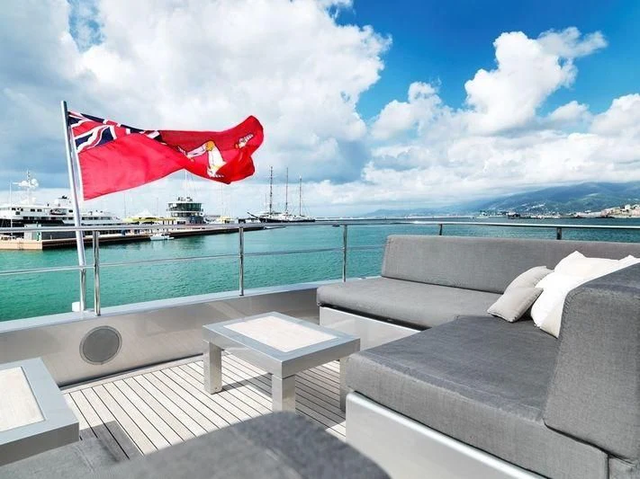 a deck with a flag on it aboard NAIA Yacht for Sale