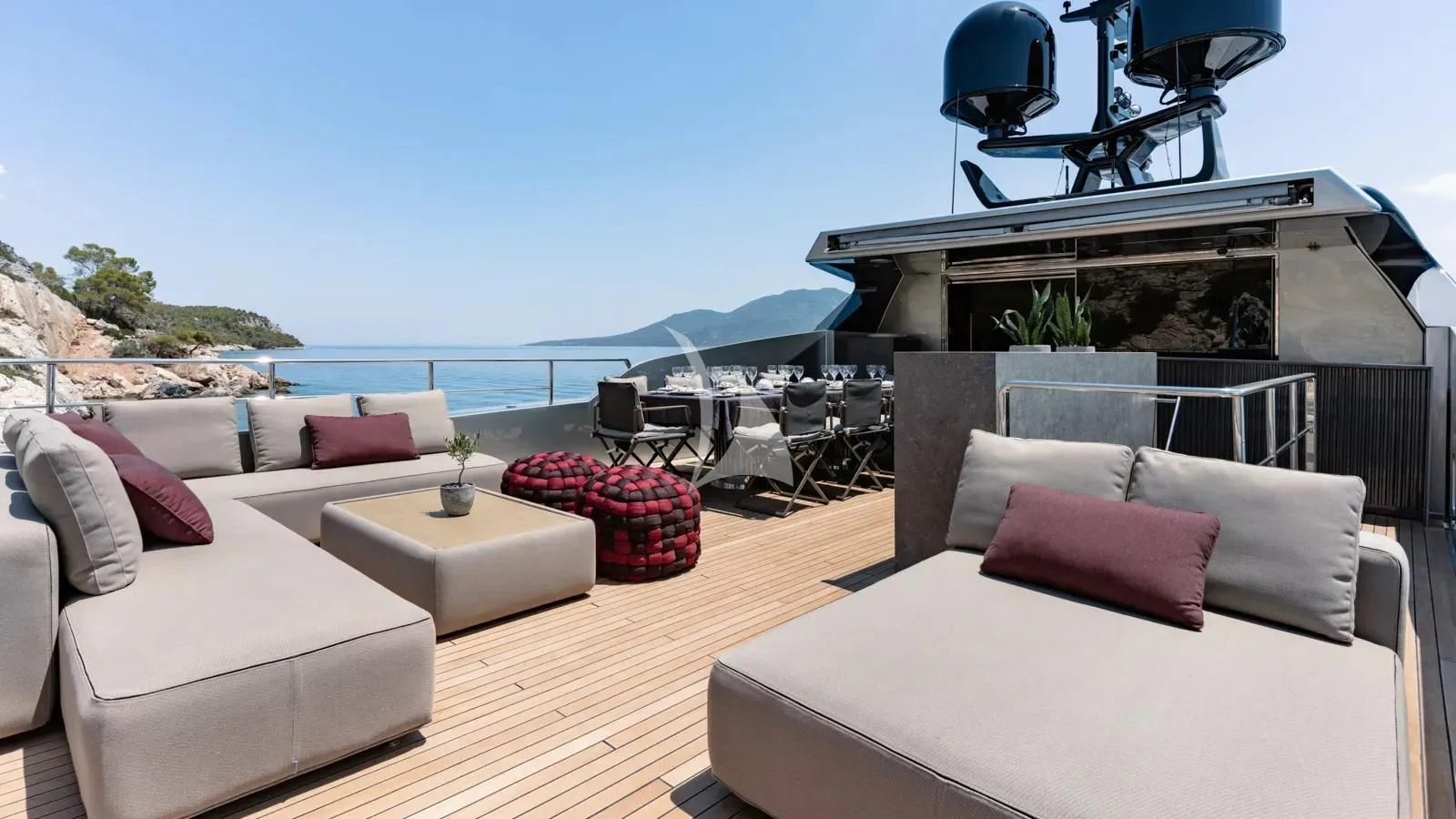 a living room with a large fireplace aboard NAIA Yacht for Sale