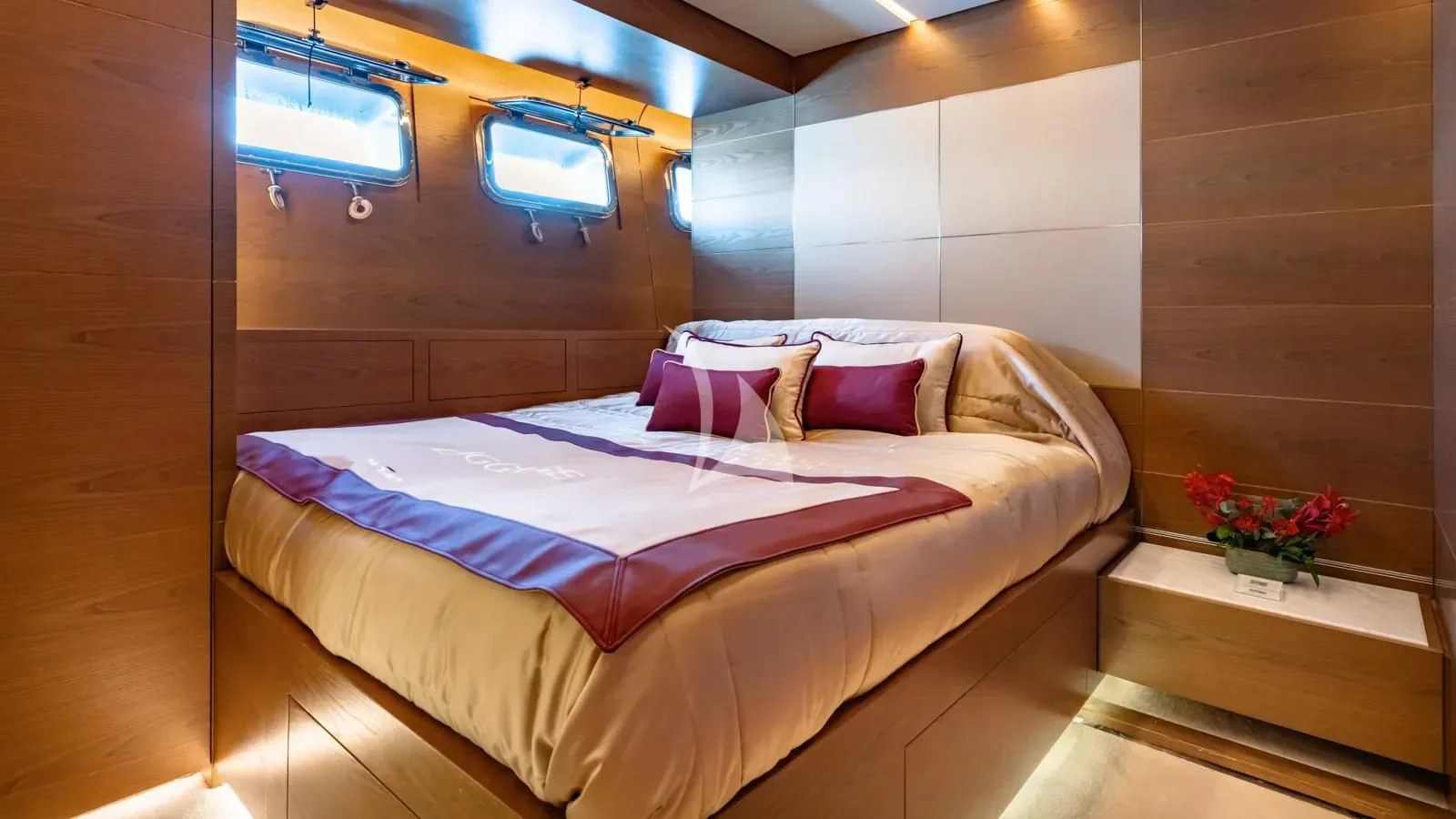 a bed in a room aboard NAIA Yacht for Sale