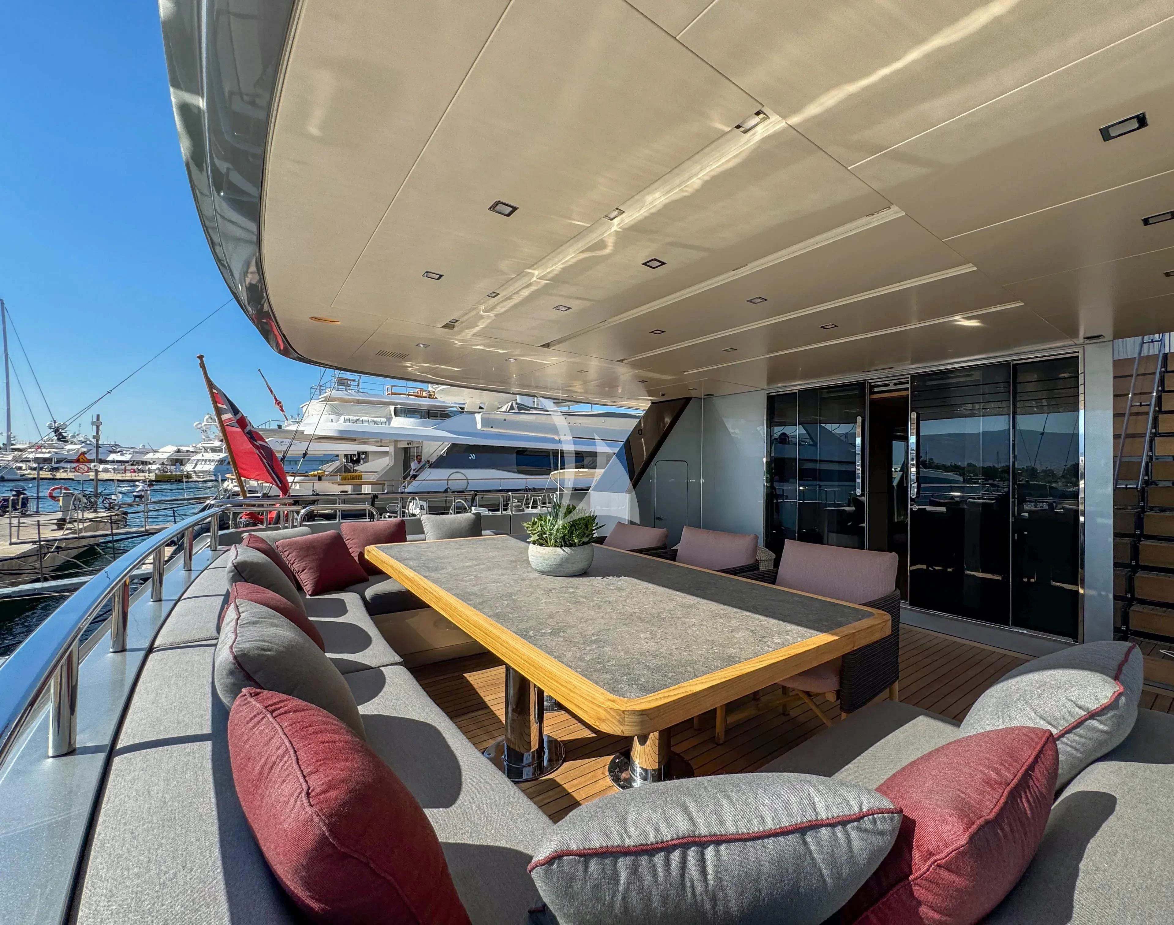 a room with a table and chairs aboard NAIA Yacht for Sale