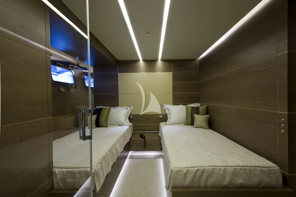 a room with two beds aboard NAIA Yacht for Sale