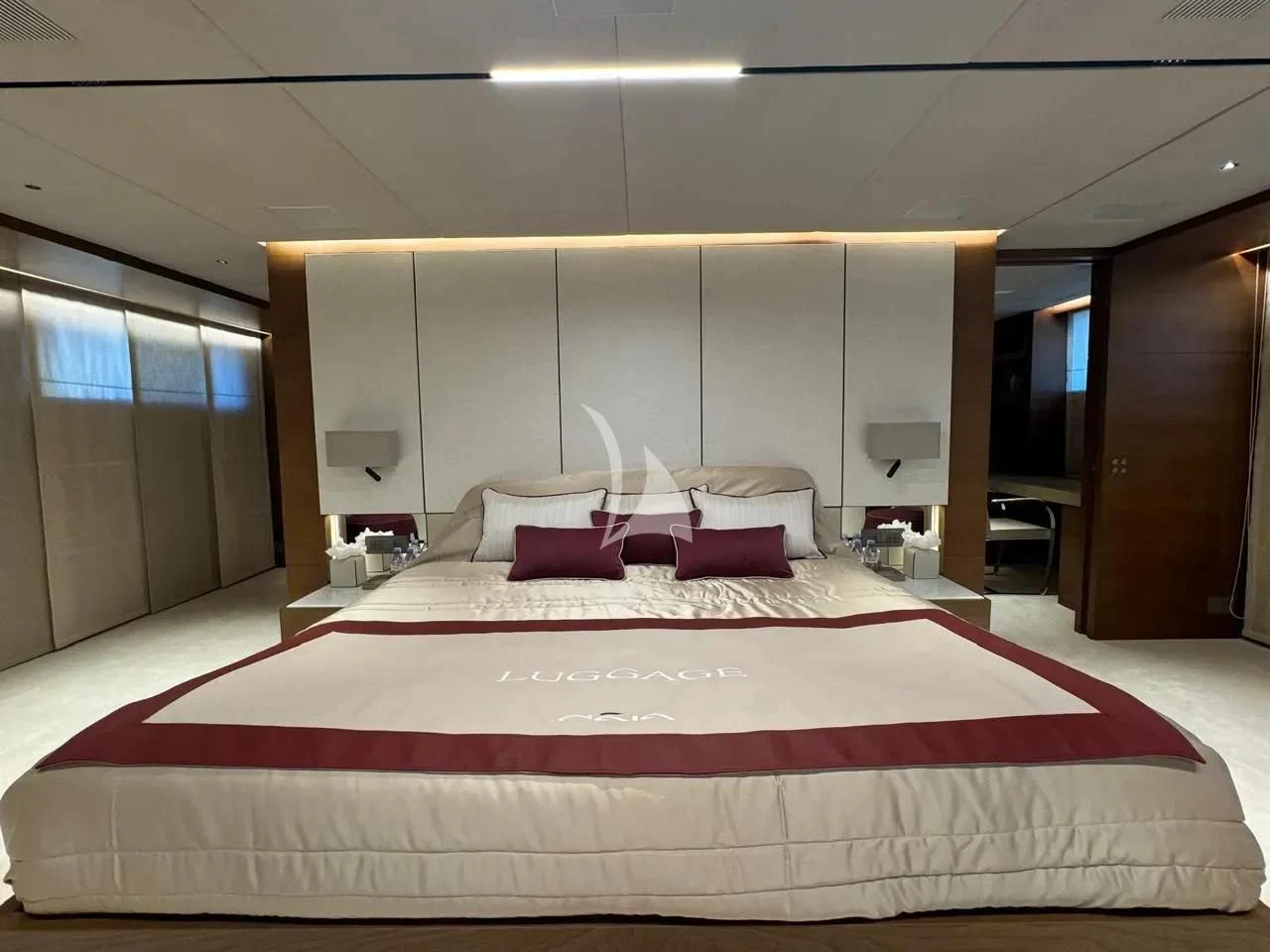 a large bed in a room aboard NAIA Yacht for Sale