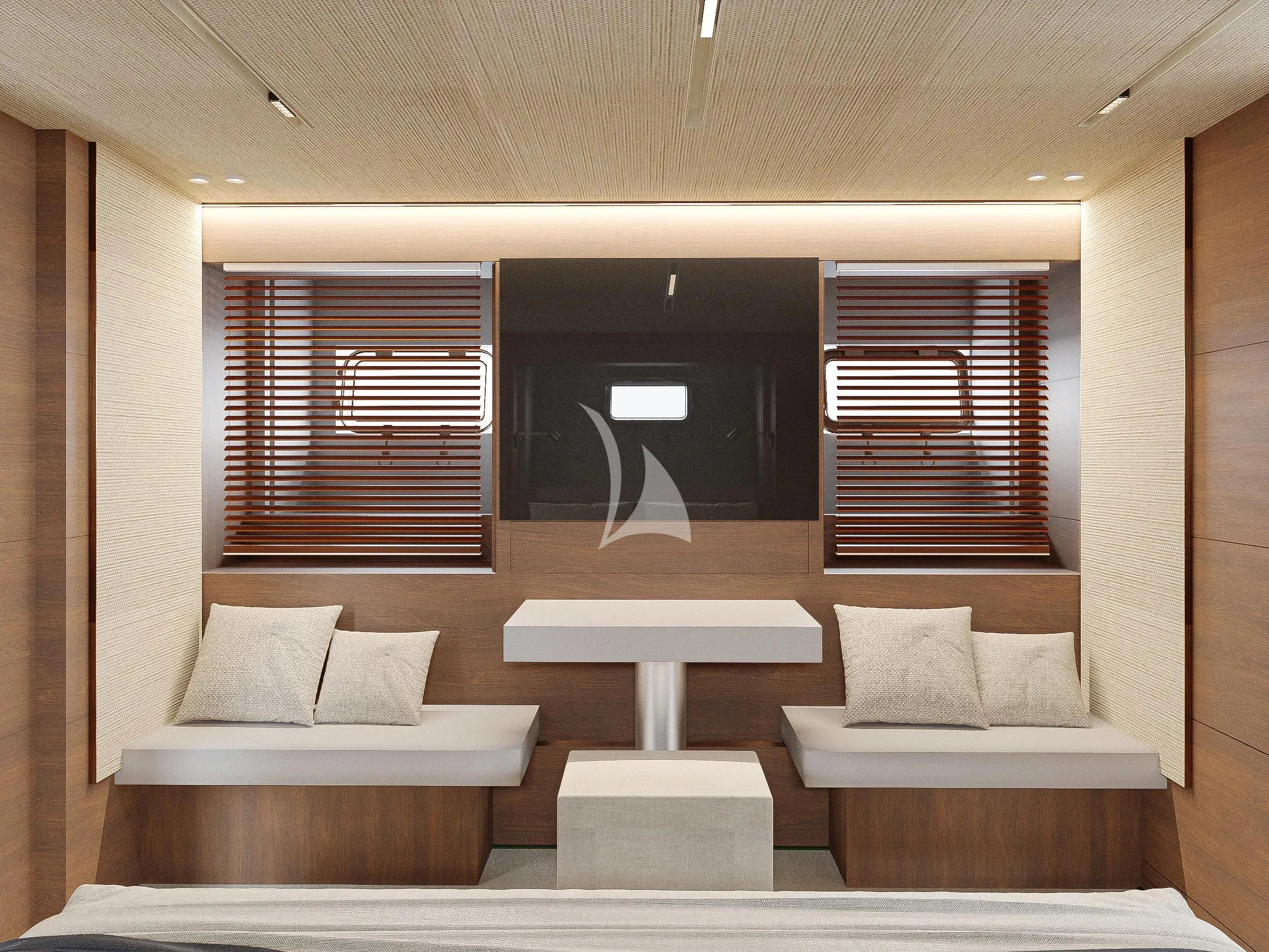 a room with a couch and a window aboard NAIA Yacht for Sale