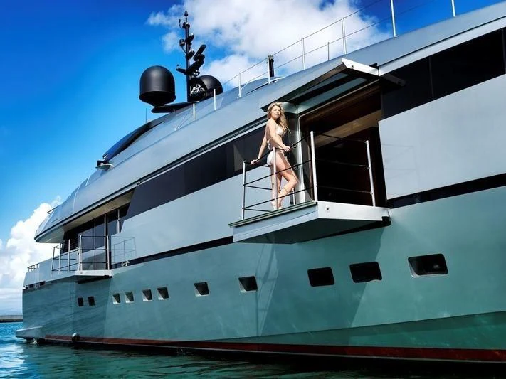 a person standing on a boat aboard NAIA Yacht for Sale