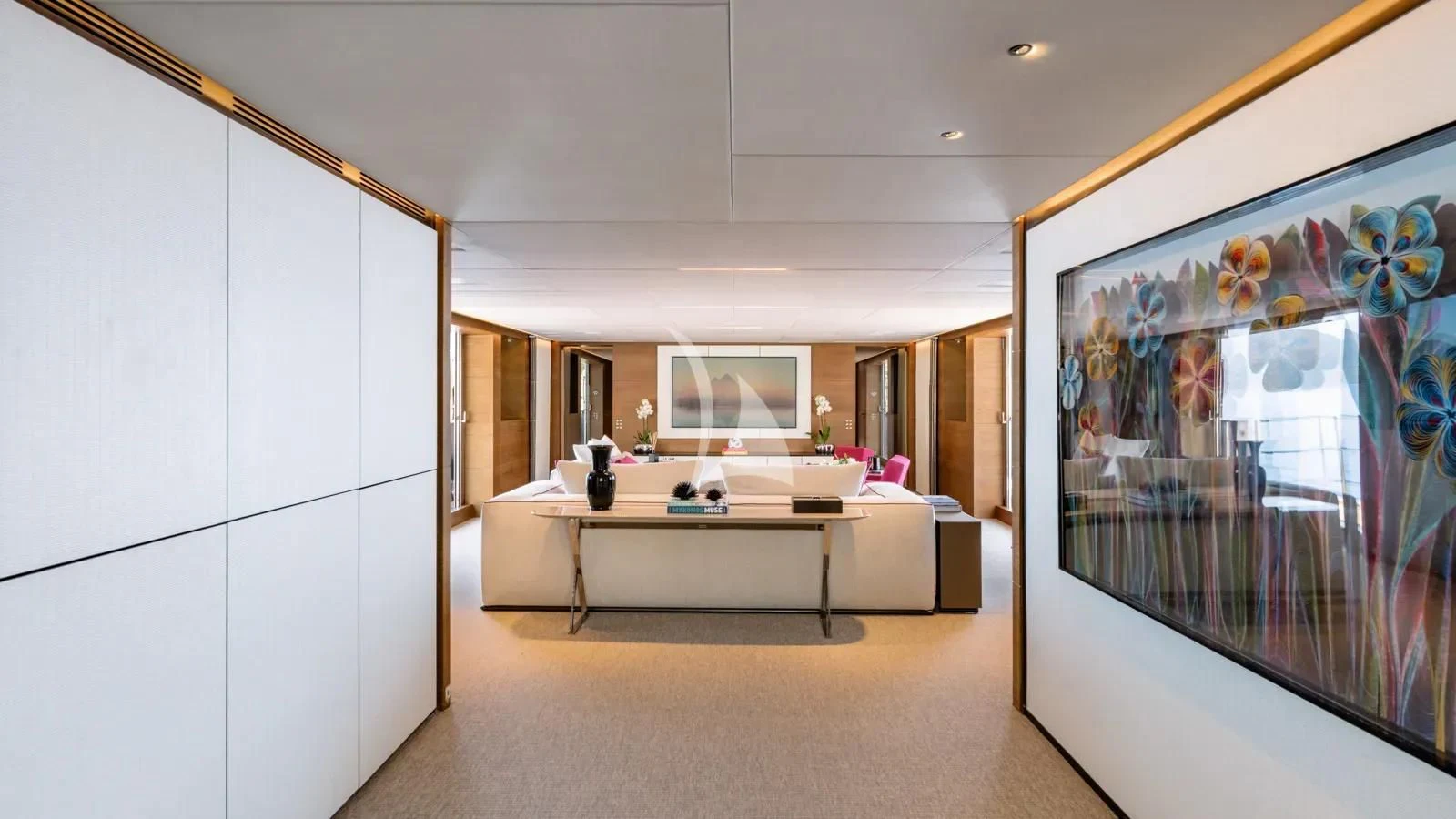 a room with a table and chairs aboard NAIA Yacht for Sale