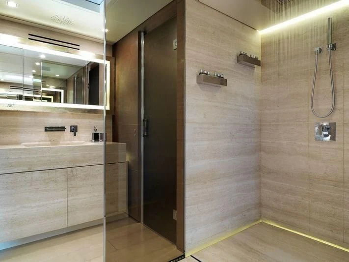 a bathroom with a shower unit aboard NAIA Yacht for Sale