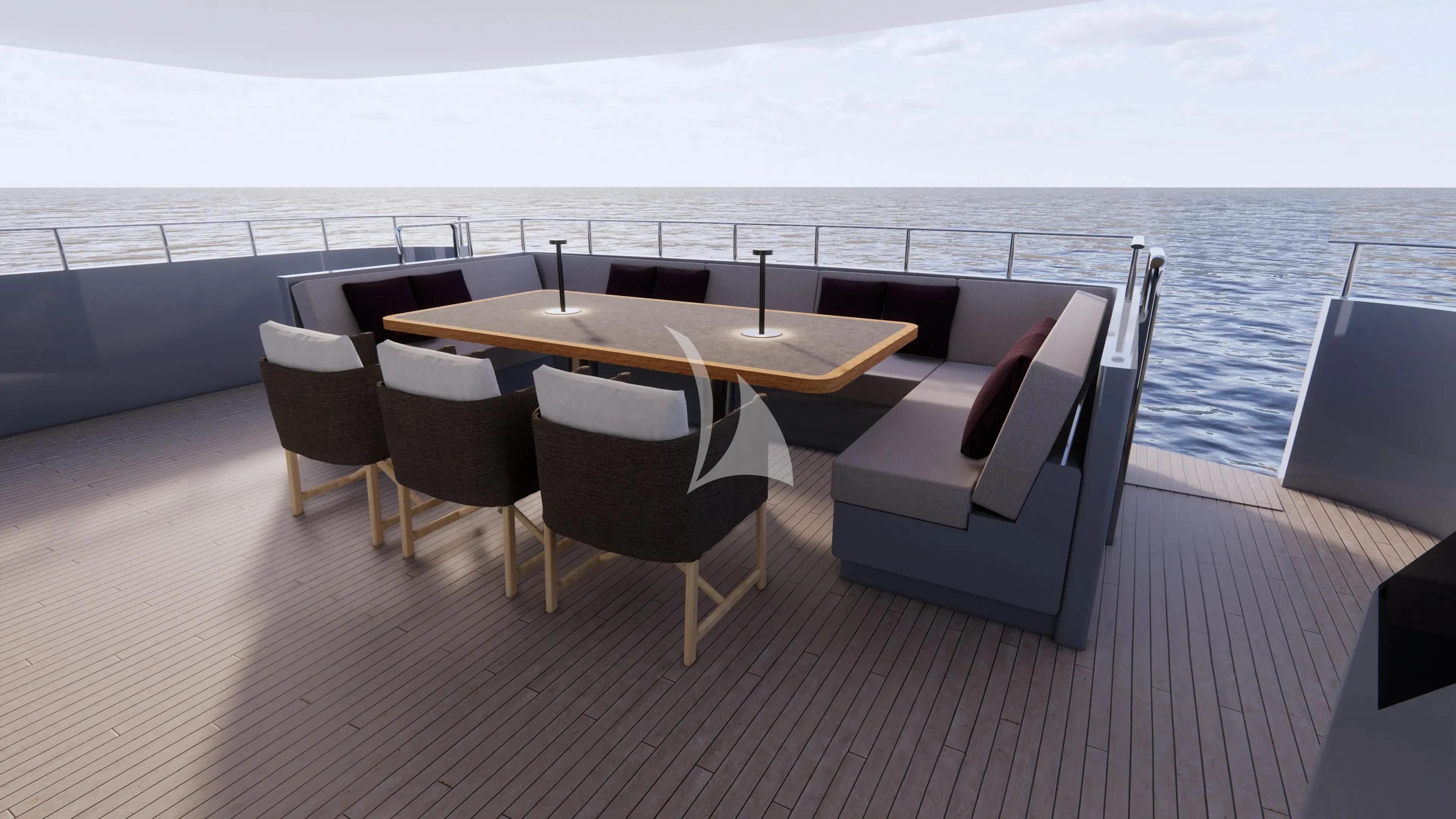 a table and chairs on a deck overlooking a large body of water aboard NAIA Yacht for Sale