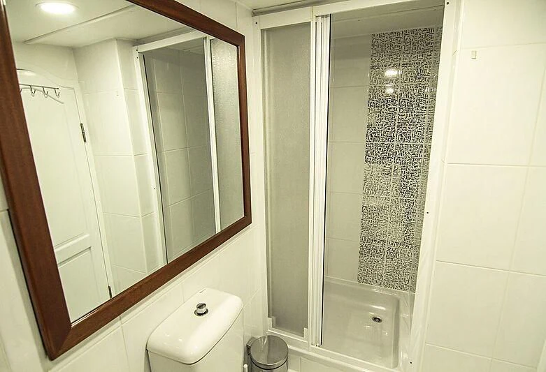 a bathroom with a glass shower aboard AURUM Yacht for Sale