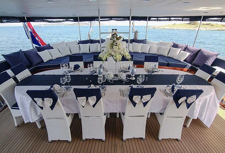 a table set for a wedding aboard AURUM Yacht for Sale