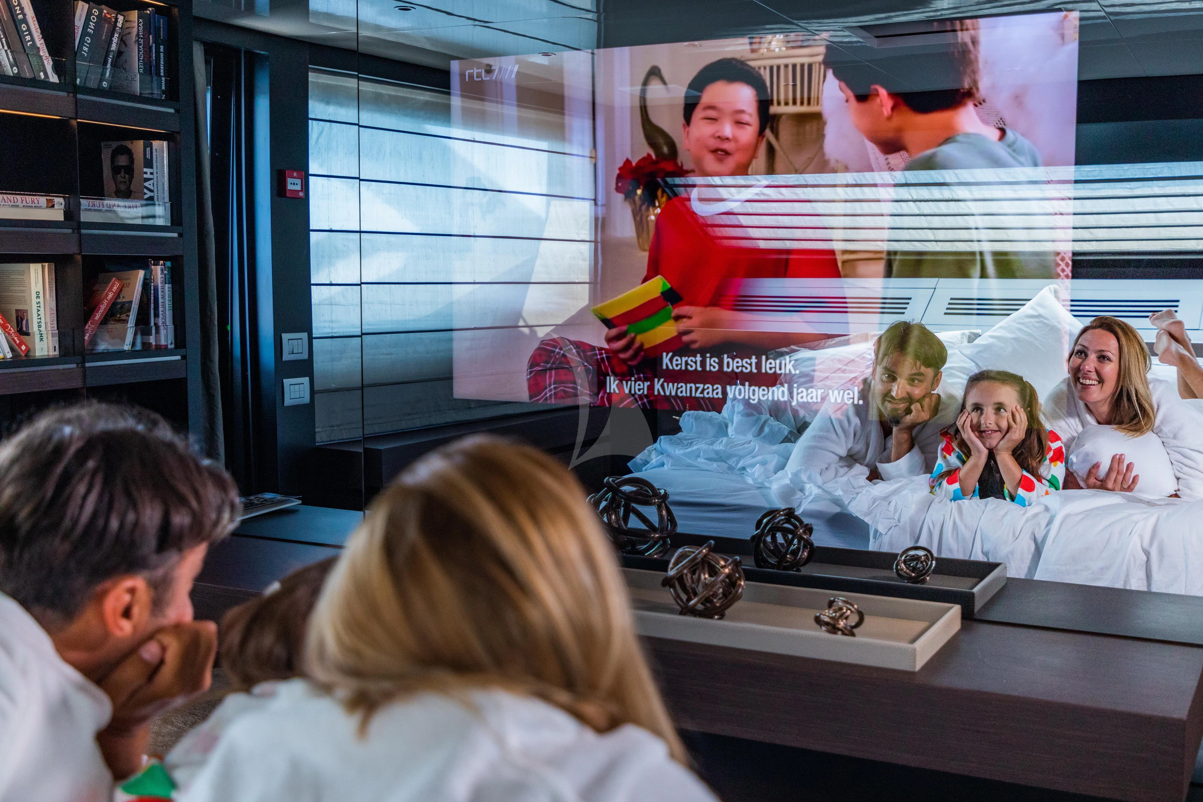 a group of people in a room aboard NOOR II Yacht for Charter