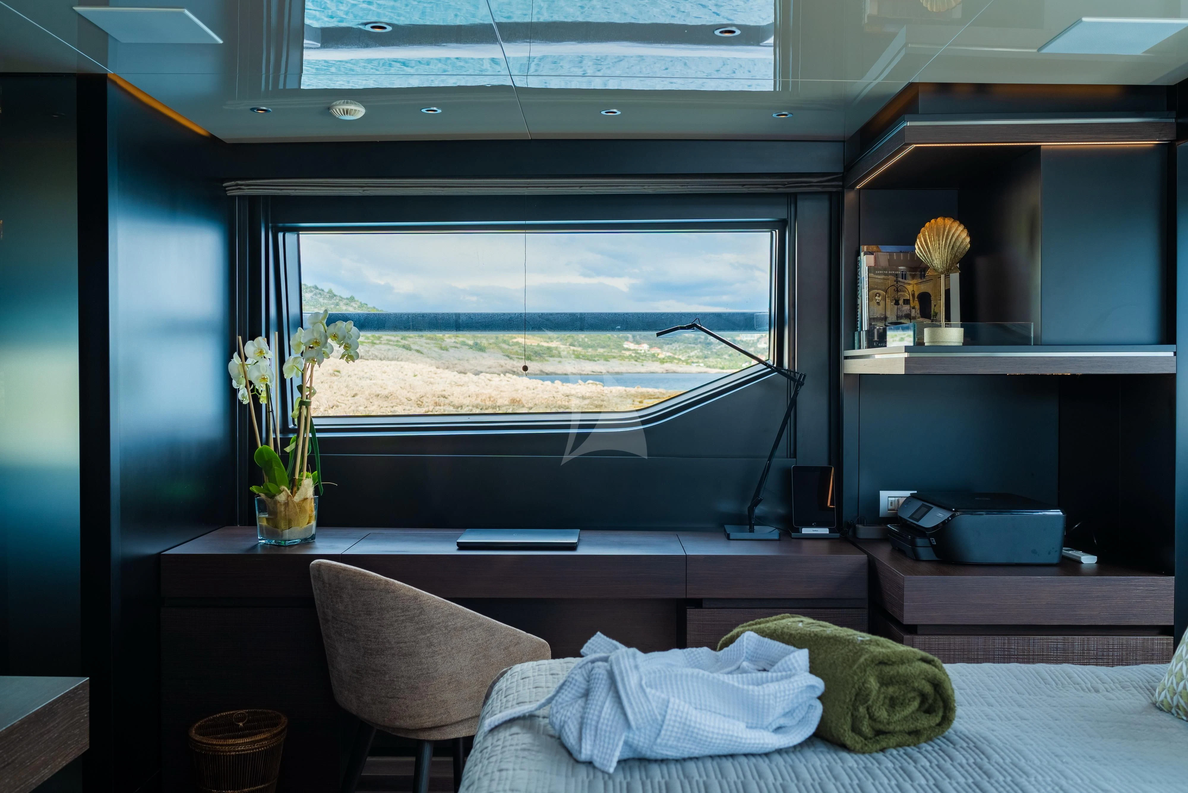 a room with a window and a bed aboard NOOR II Yacht for Charter