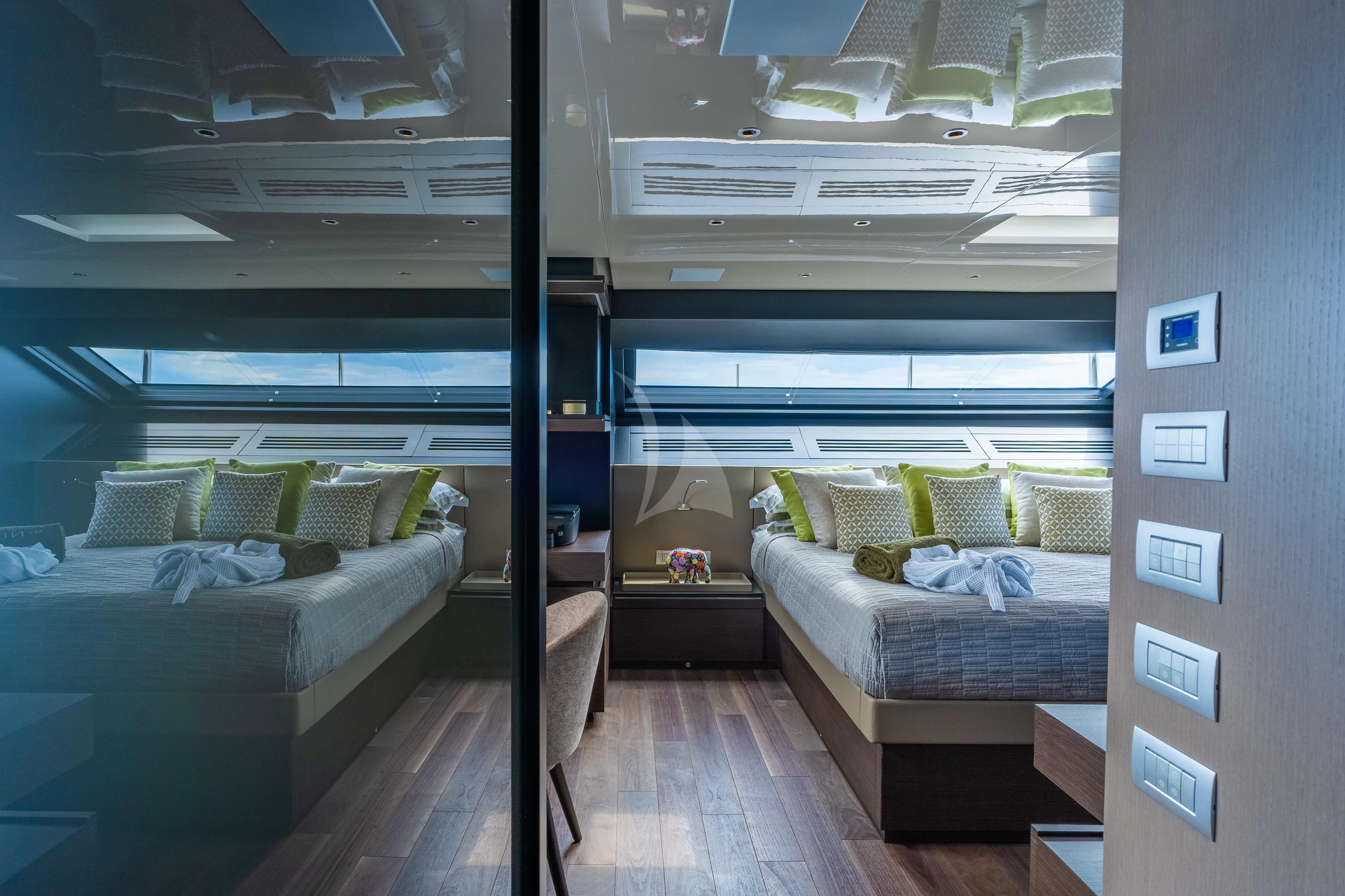 a room with a bed and a couch aboard NOOR II Yacht for Charter