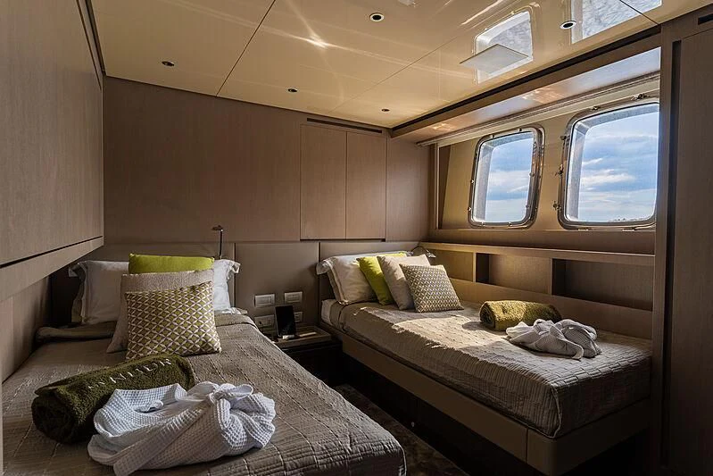 a couple of beds in a room aboard NOOR II Yacht for Charter