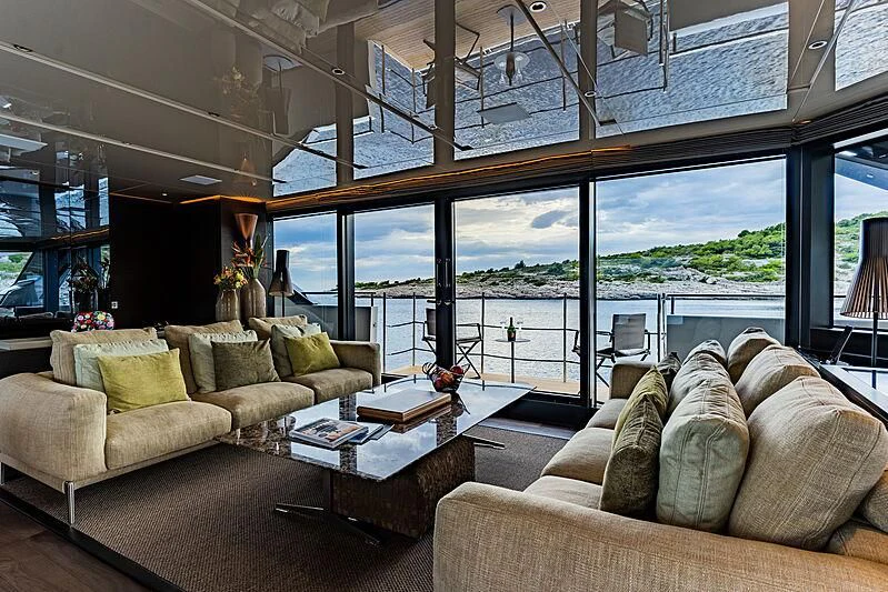 a living room with a large window aboard NOOR II Yacht for Charter