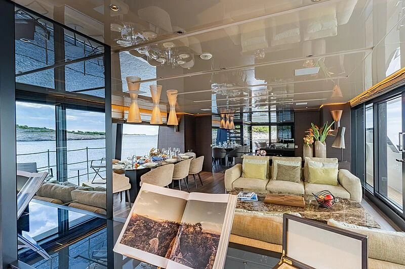 a living room with a large window aboard NOOR II Yacht for Charter
