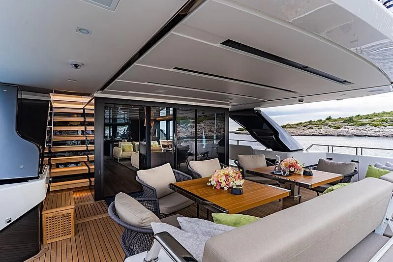 a living room with a large glass door aboard NOOR II Yacht for Charter