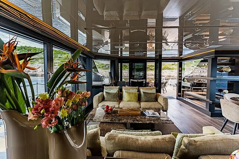 a living room with a large glass window aboard NOOR II Yacht for Charter
