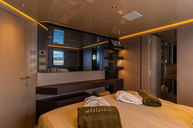 a hotel room with a bed aboard NOOR II Yacht for Charter