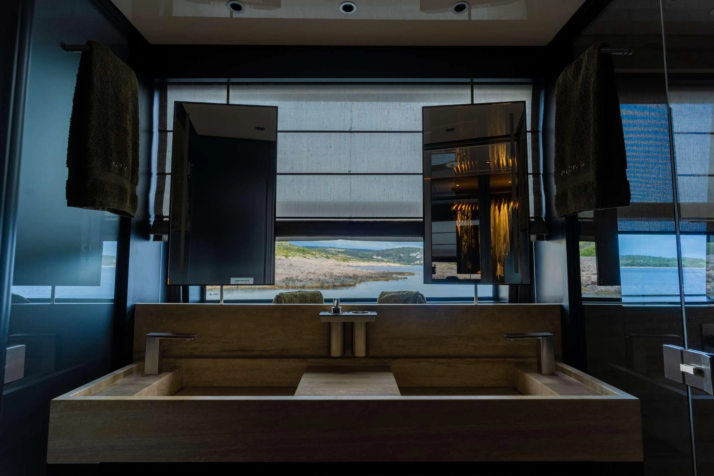 a room with a large window and a wood desk with a large window aboard NOOR II Yacht for Charter