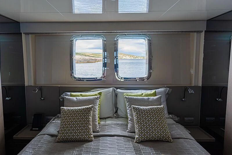 a bed with pillows aboard NOOR II Yacht for Charter