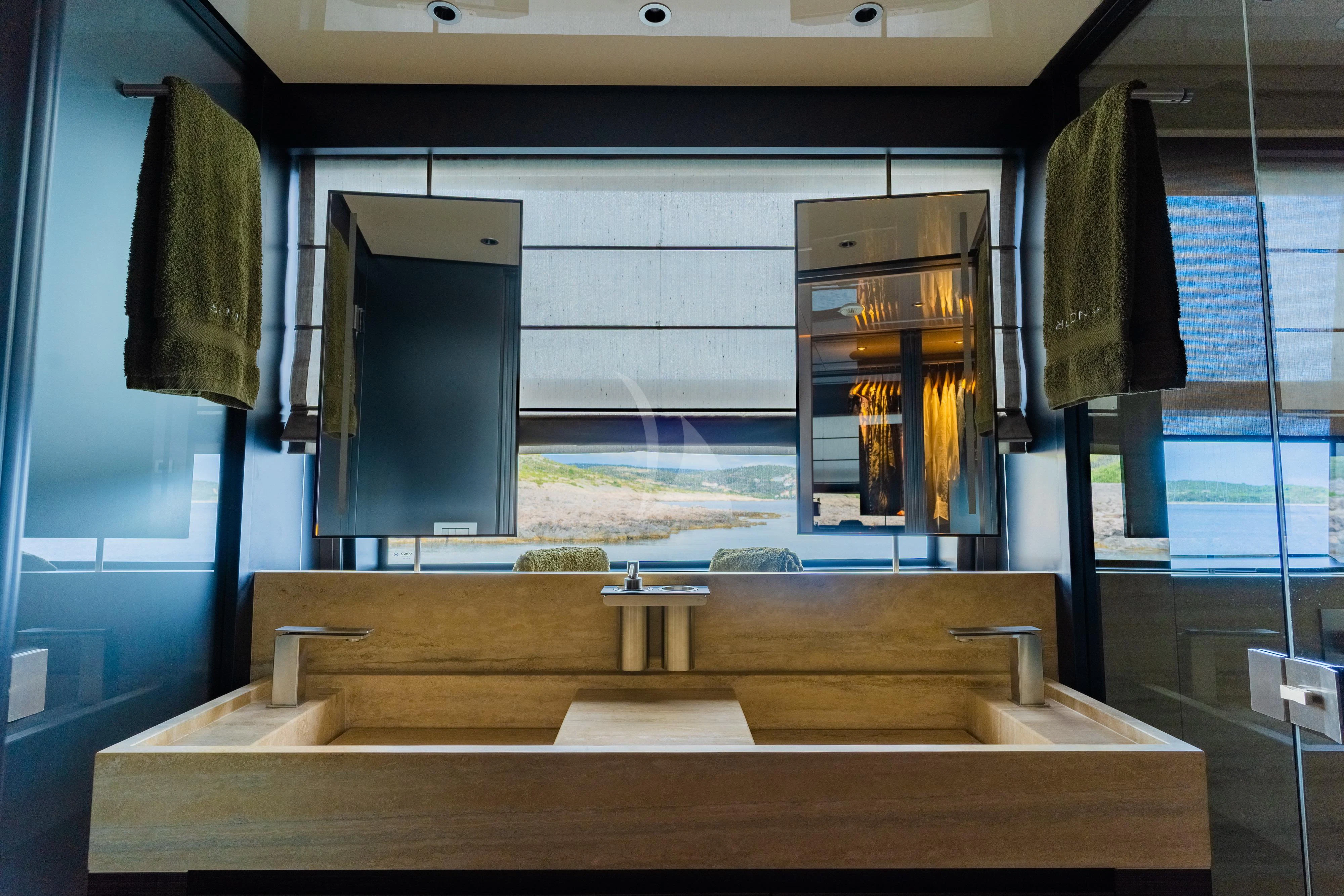 a room with a desk and a window aboard NOOR II Yacht for Charter