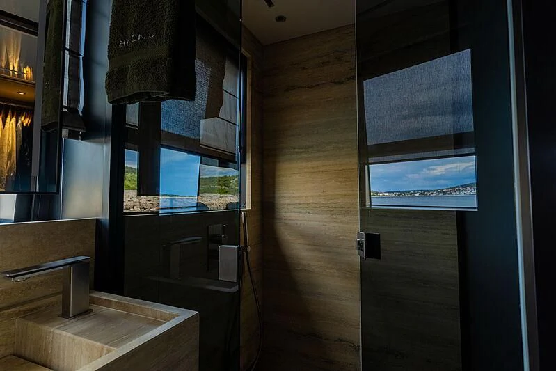 a room with a wood floor and a window aboard NOOR II Yacht for Charter