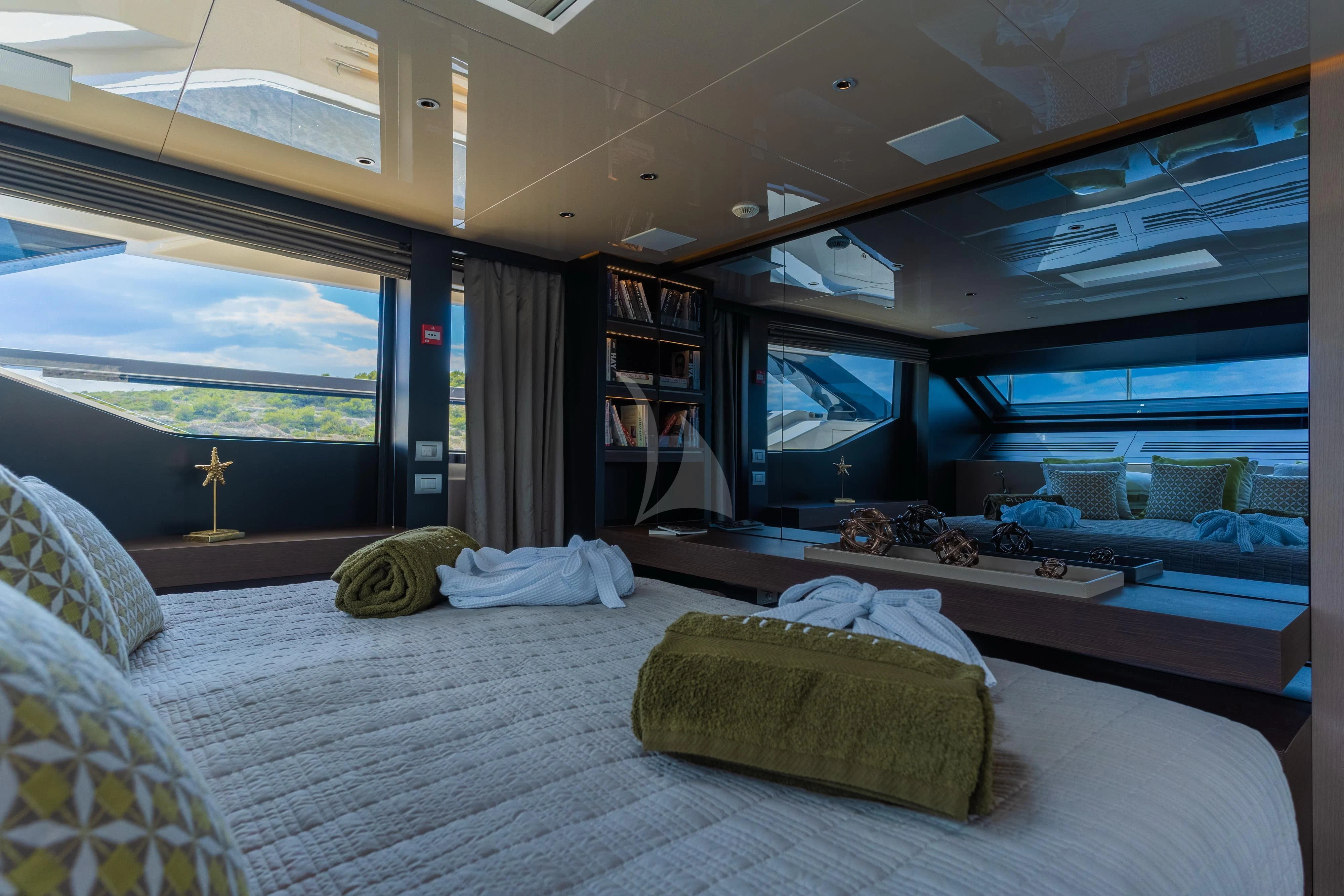 a room with a bed and a tv aboard NOOR II Yacht for Charter