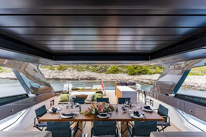 a room with a table and chairs aboard NOOR II Yacht for Charter