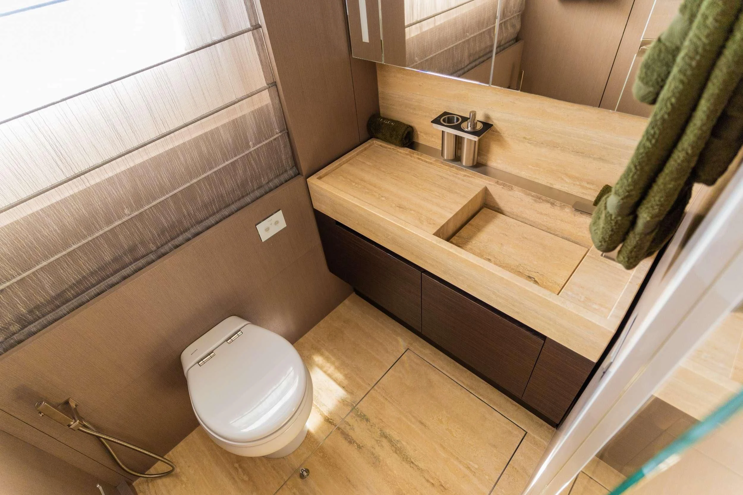 a bathroom with a sink and toilet aboard NOOR II Yacht for Charter
