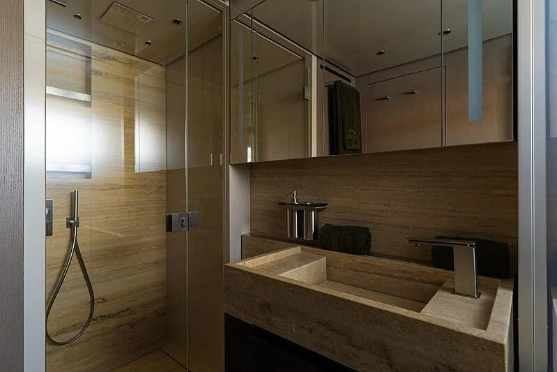 a bathroom with a wood floor aboard NOOR II Yacht for Charter