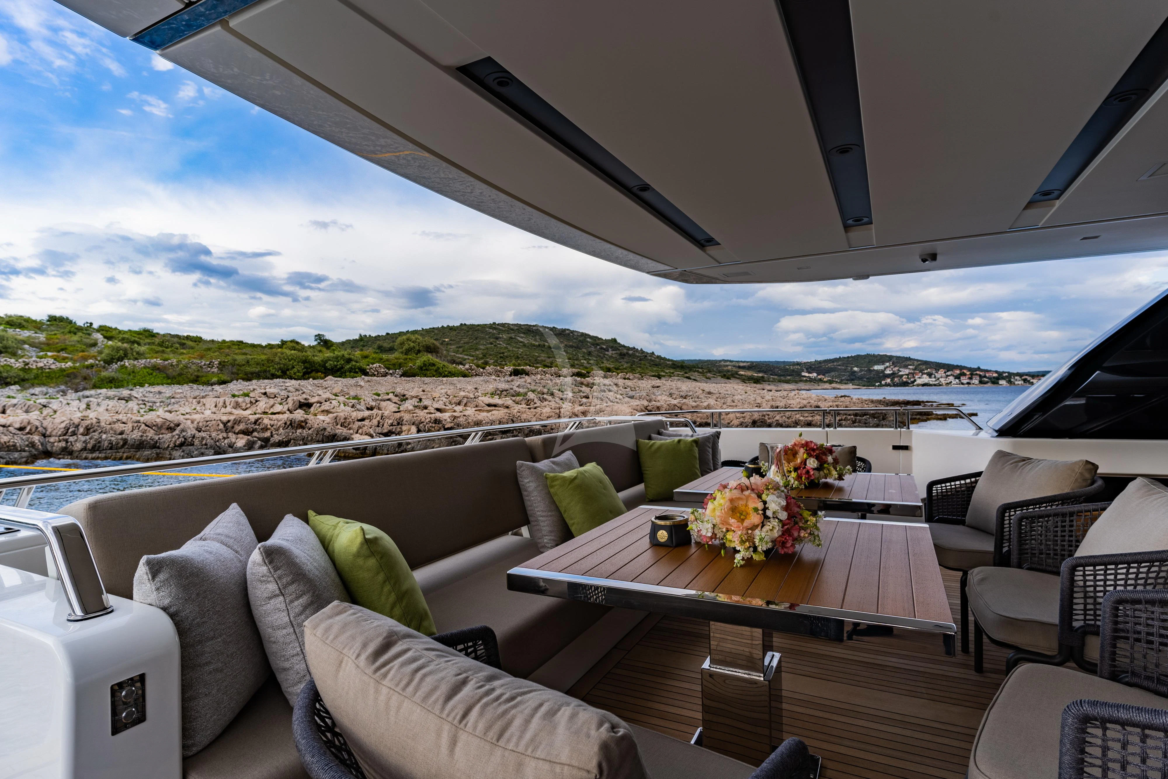 a room with a table and chairs aboard NOOR II Yacht for Charter
