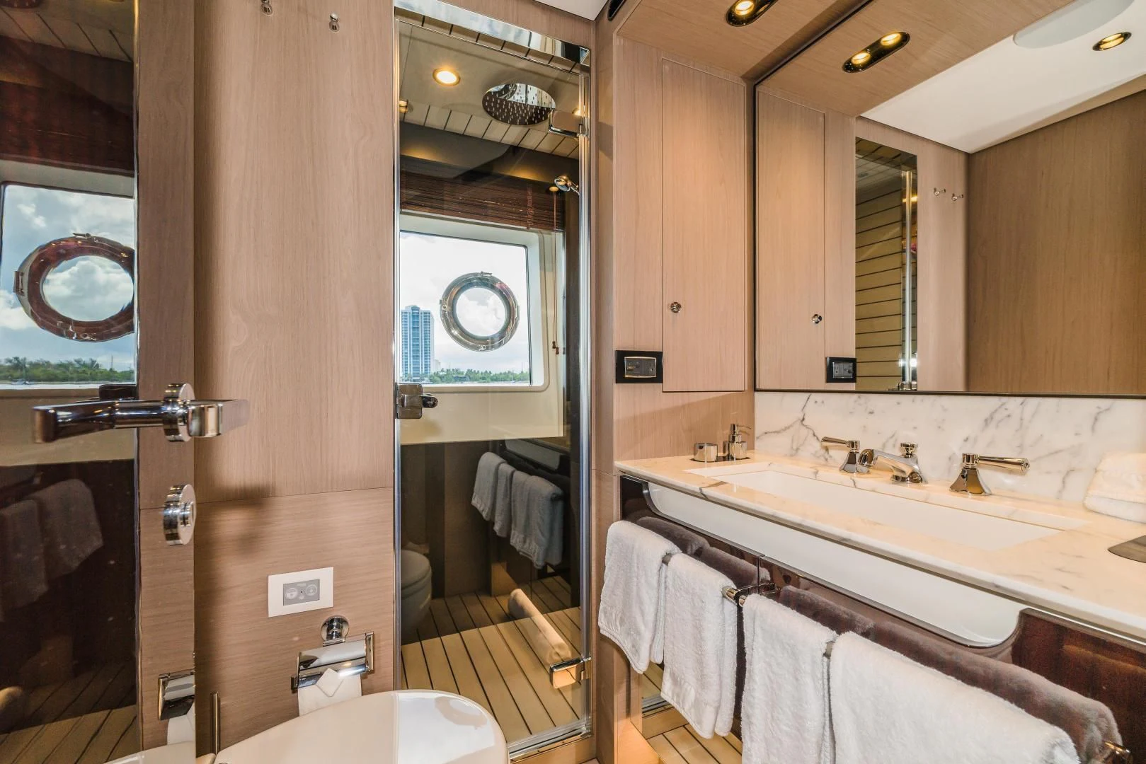 a bathroom with a large mirror aboard MAJESTIC MOMENTS Yacht for Sale