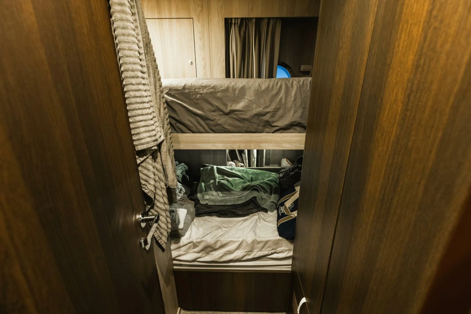 a closet with clothes and clothes aboard MAJESTIC MOMENTS Yacht for Sale