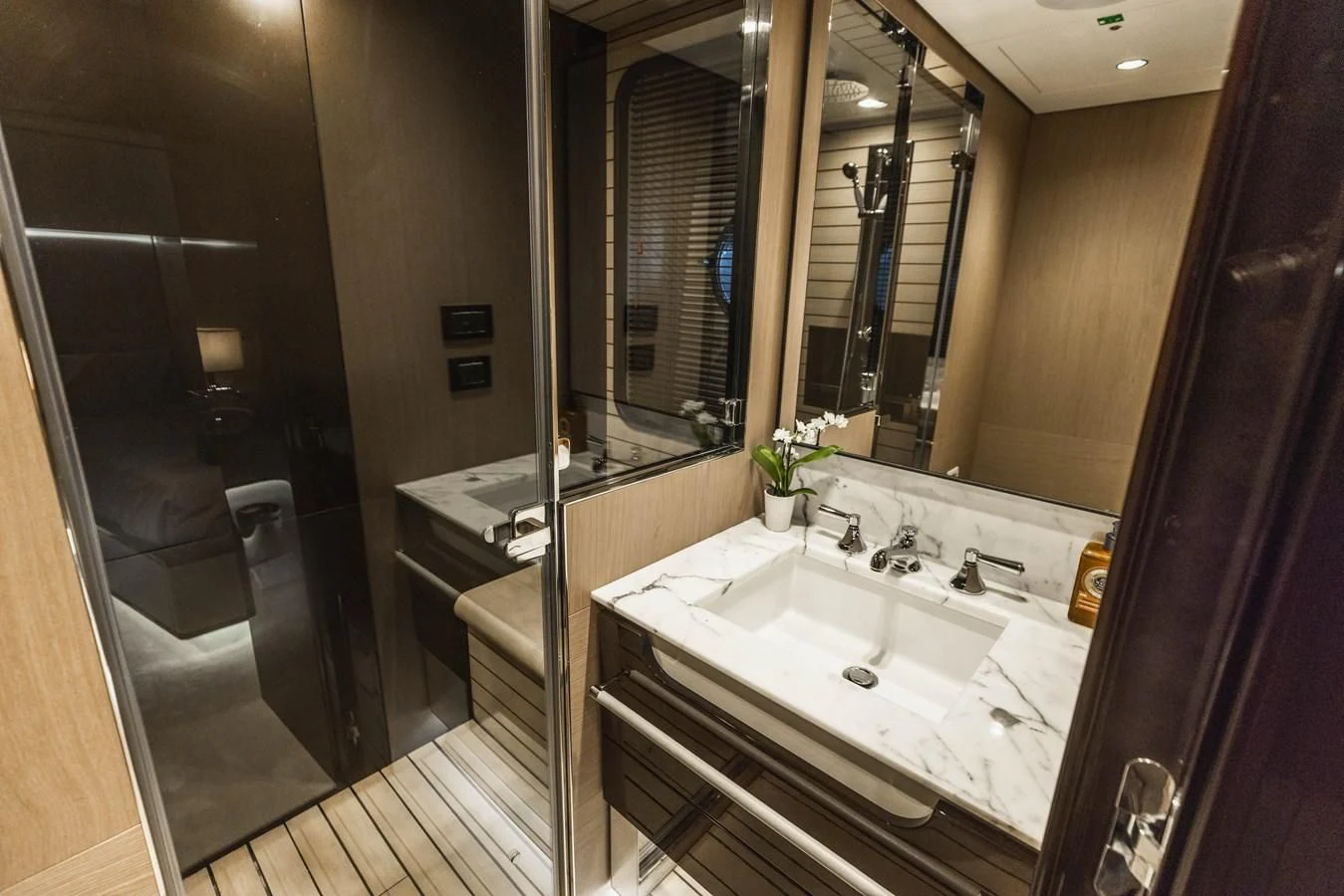 a bathroom with a large mirror aboard MAJESTIC MOMENTS Yacht for Sale