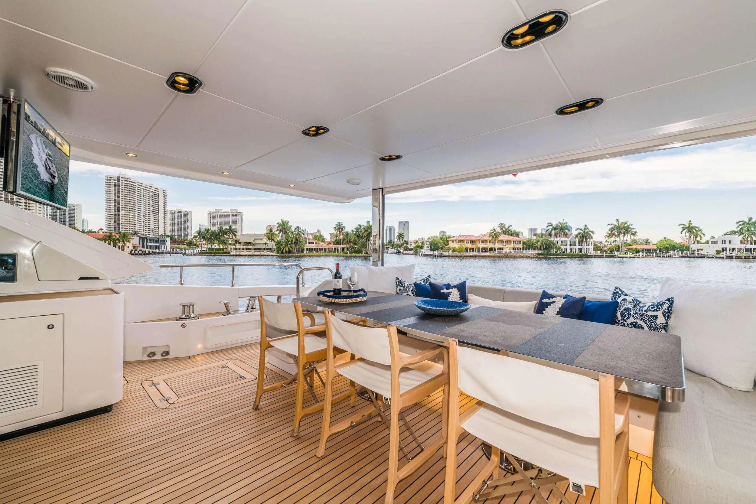 a large living room with a large pool and a city skyline aboard MAJESTIC MOMENTS Yacht for Sale