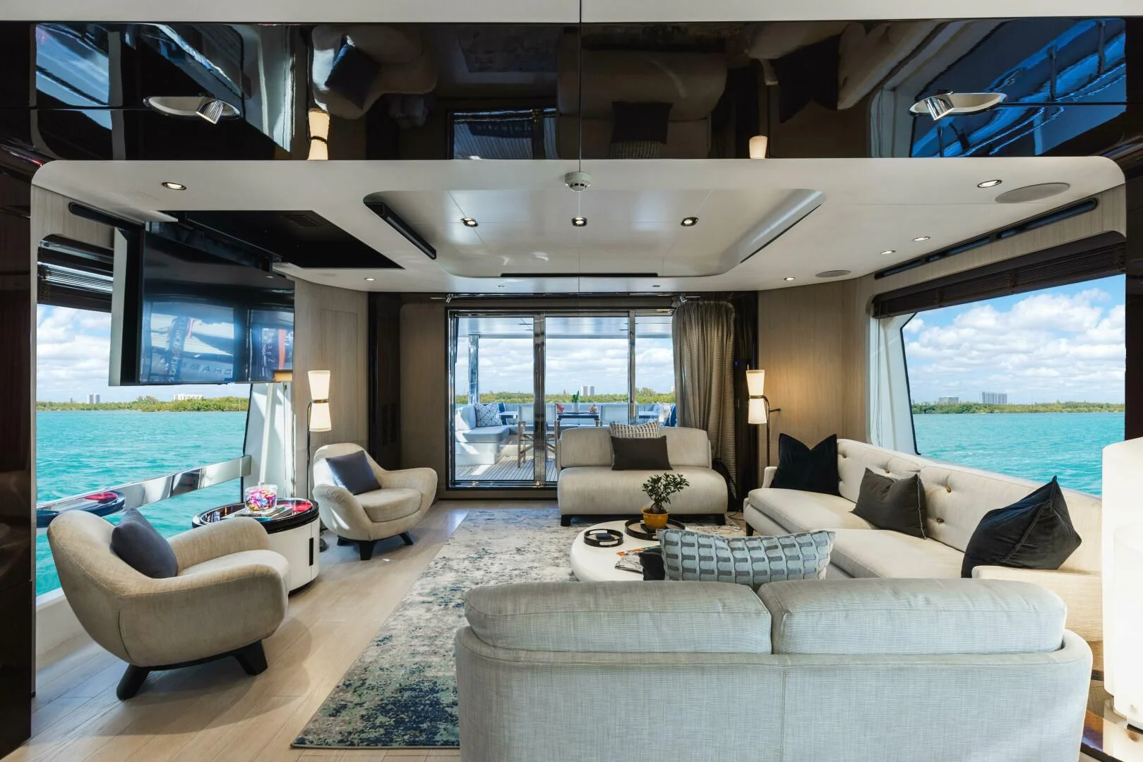 a living room with a large swimming pool aboard MAJESTIC MOMENTS Yacht for Sale