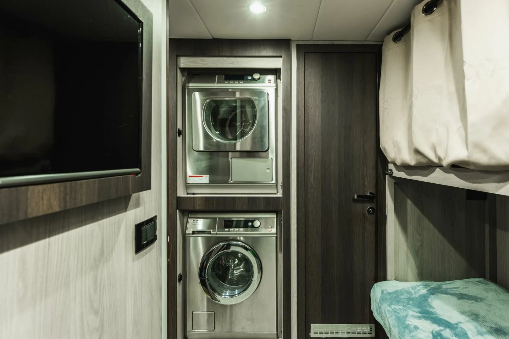 a washer and dryer in a room aboard MAJESTIC MOMENTS Yacht for Sale
