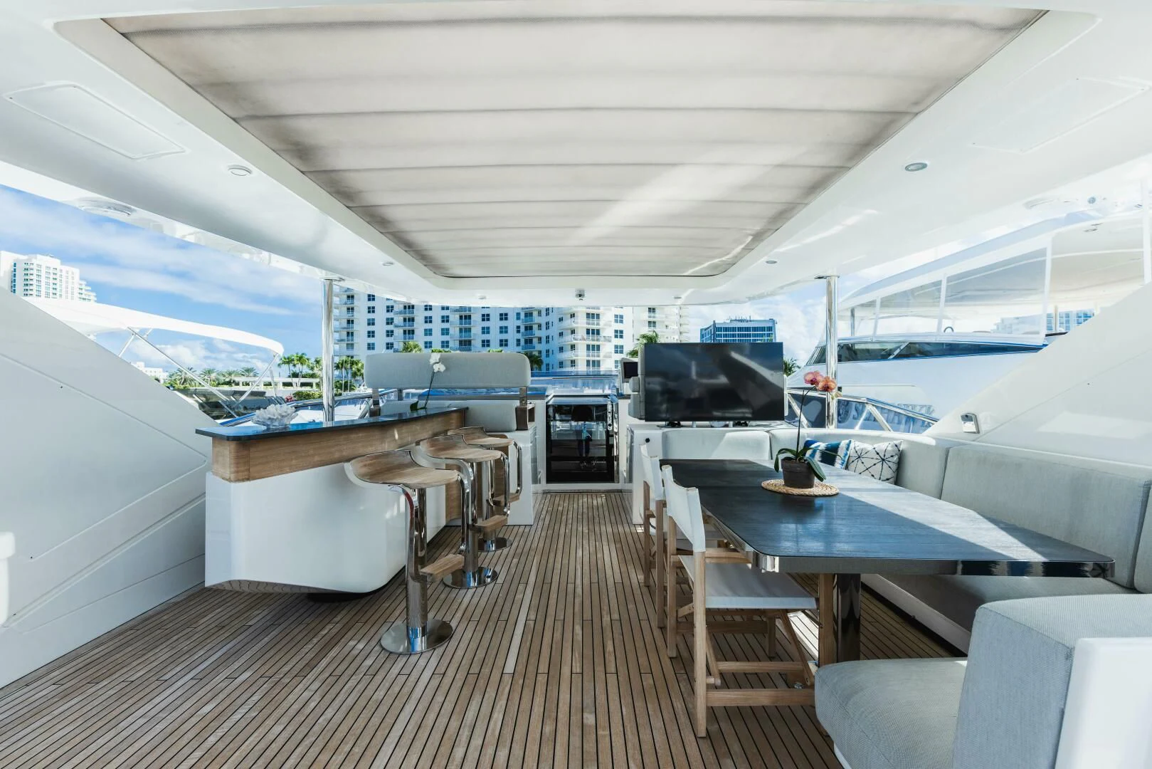 a room with a table and chairs aboard MAJESTIC MOMENTS Yacht for Sale