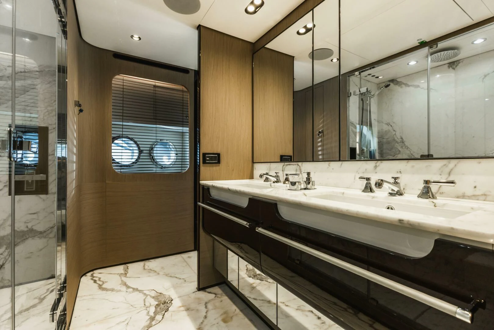 a bathroom with a large mirror aboard MAJESTIC MOMENTS Yacht for Sale