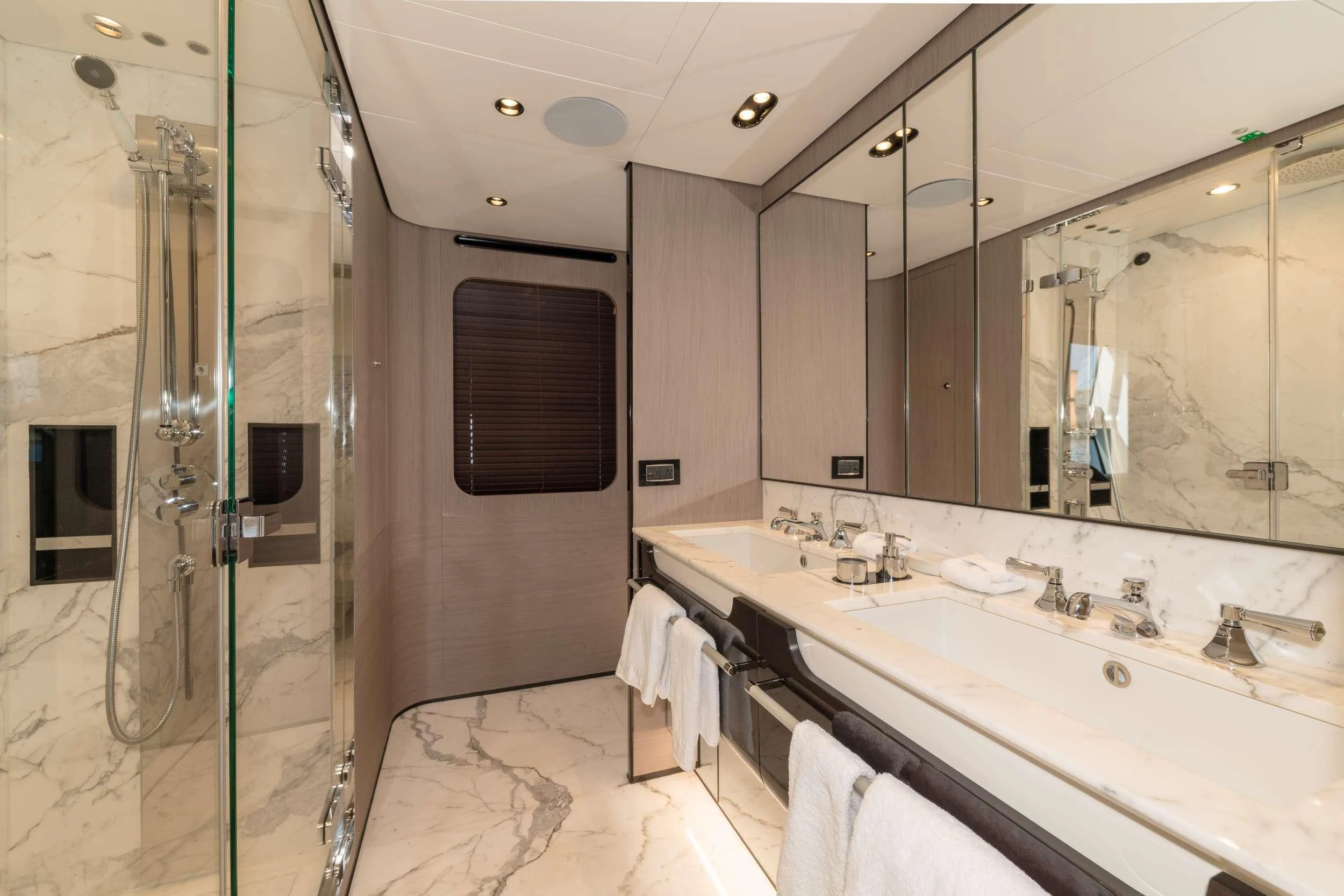 a bathroom with a glass shower aboard MAJESTIC MOMENTS Yacht for Sale