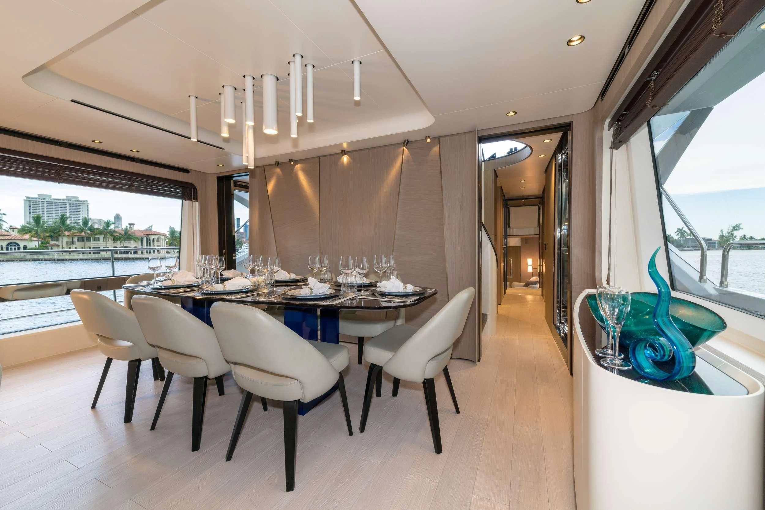 a room with a table and chairs aboard MAJESTIC MOMENTS Yacht for Sale
