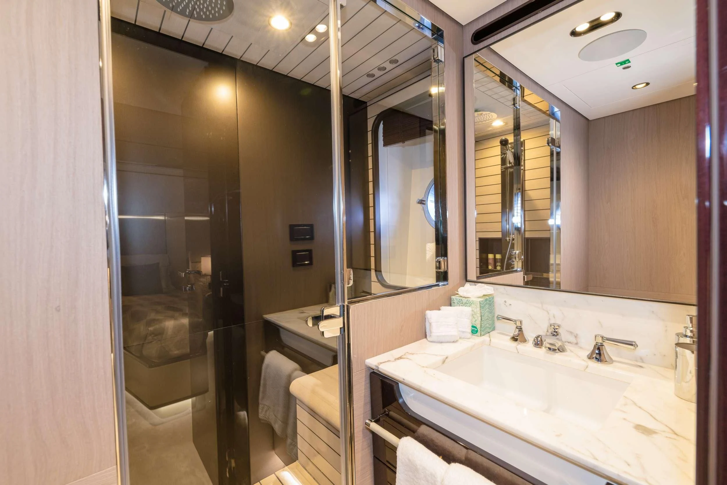 a bathroom with a large mirror aboard MAJESTIC MOMENTS Yacht for Sale