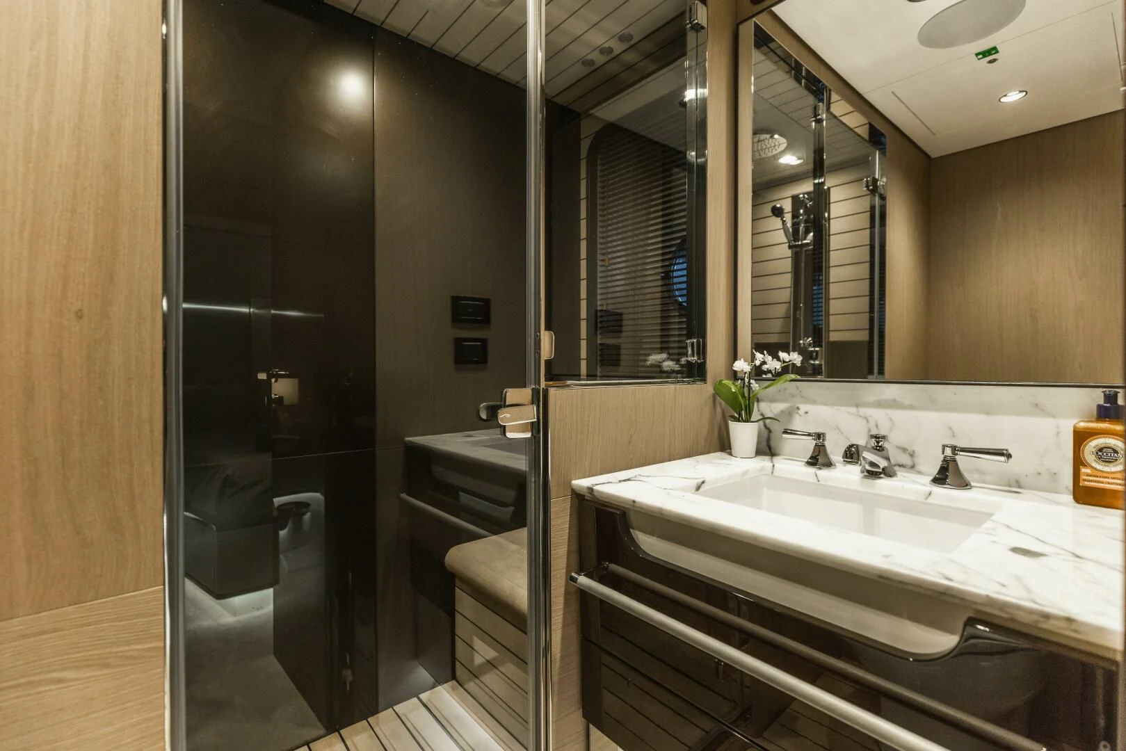 a bathroom with a large mirror aboard MAJESTIC MOMENTS Yacht for Sale