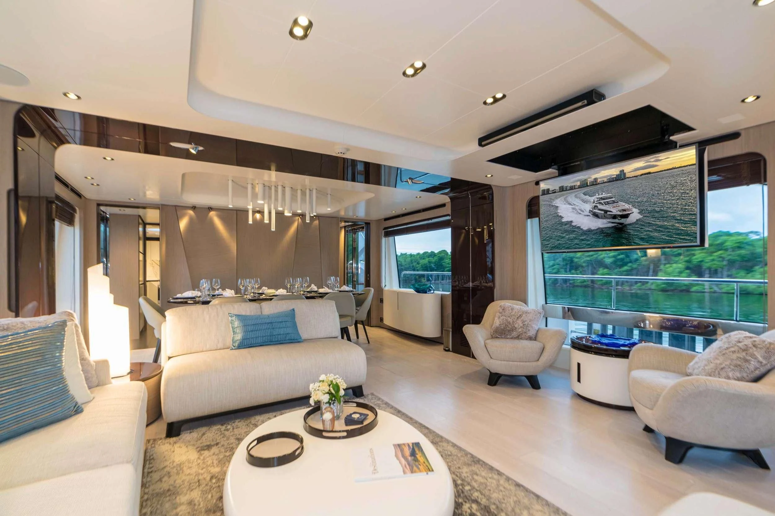 a living room with a large window aboard MAJESTIC MOMENTS Yacht for Sale
