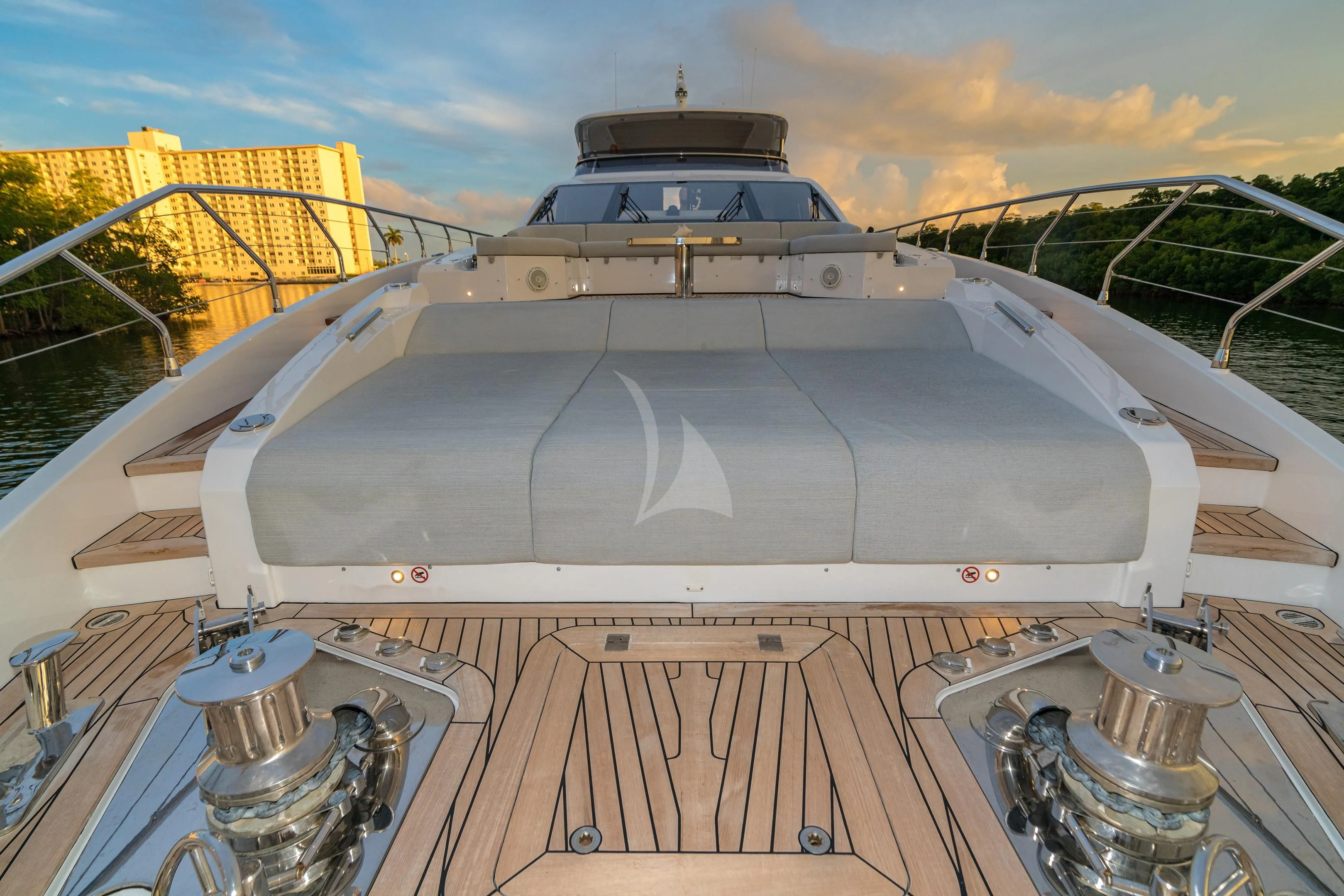 a large white boat on a wooden deck aboard MAJESTIC MOMENTS Yacht for Sale