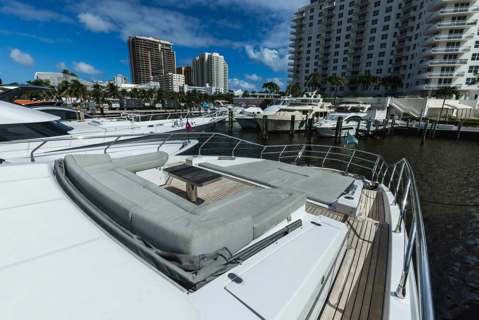 a large white boat in a harbor aboard MAJESTIC MOMENTS Yacht for Sale