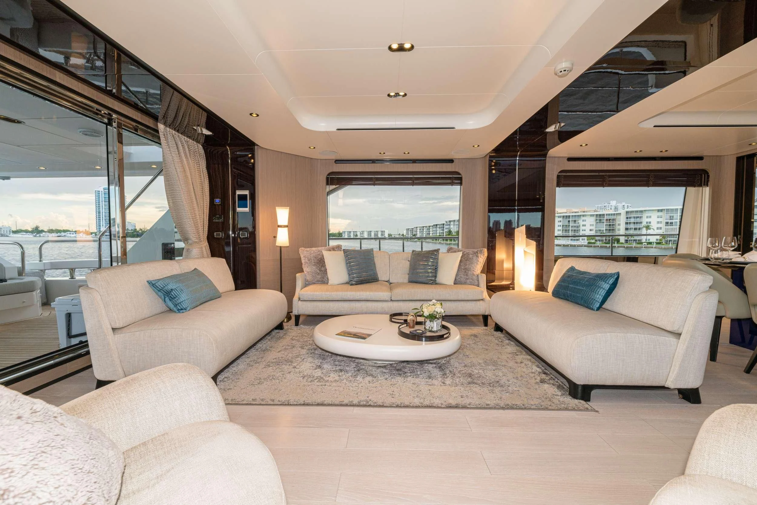 a living room with a couch and a table aboard MAJESTIC MOMENTS Yacht for Sale