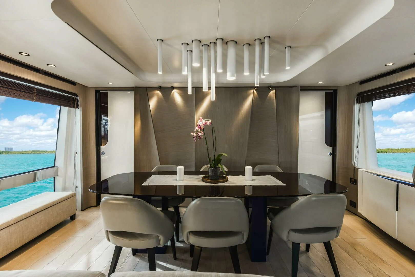 a room with a table and chairs aboard MAJESTIC MOMENTS Yacht for Sale